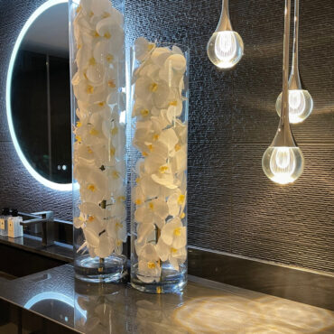 Glass Cylinder With White Phalaenopsis Orchids