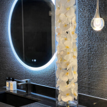 Glass Cylinder With White Phalaenopsis Orchids