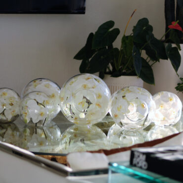10″ Crosswinds vase with white orchids