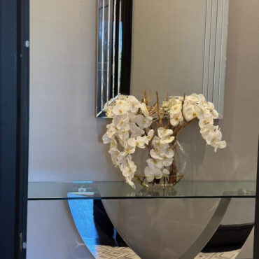 16″ Moon vase with white orchids