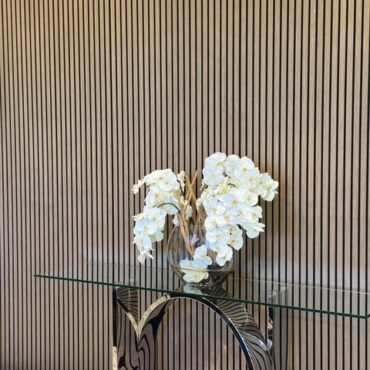 16″ Moon vase with white orchids