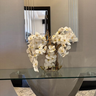 16″ Moon vase with white orchids