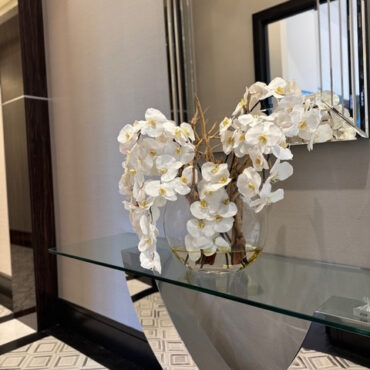 16″ Moon vase with white orchids