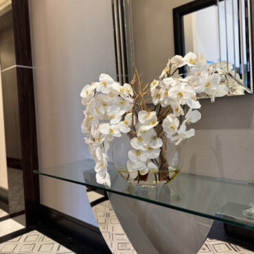 16″ Moon vase with white orchids